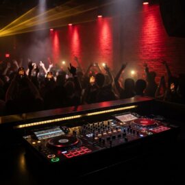 Professional Pioneer CDJ DJ booth at a packed Atlanta nightclub with red stage lights and gold lasers — Di-VerZe E.N.T Live DJ Package for clubs and events